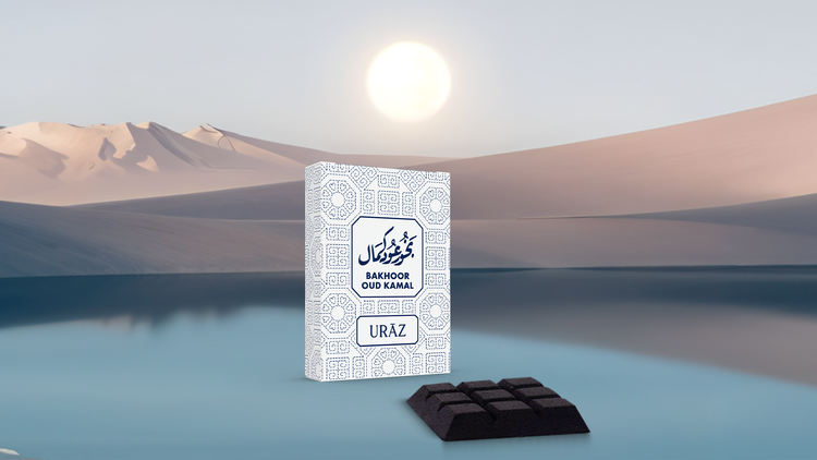 Packaging with text "URAZ Bakhoor Oud Kamal" in a desert landscape with mountains and sun.
