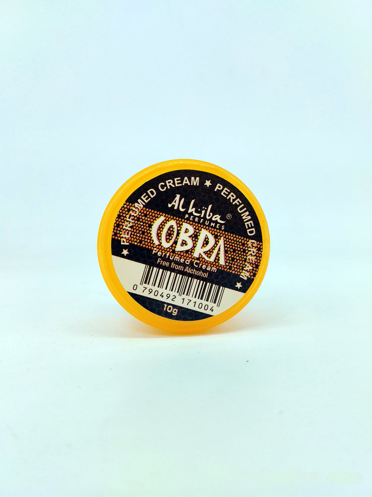 Perfumed cream container labeled 'Cobra' on a light blue background