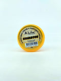 Small container of Alhiba Perfumes Emirates cream on a light gray background
