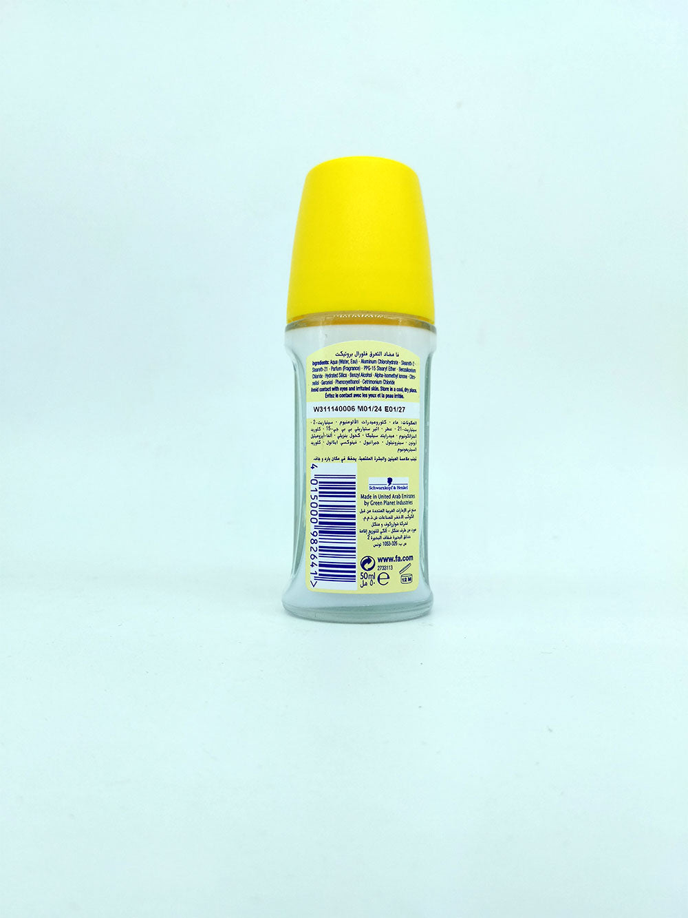 Deodorant bottle with yellow cap on a light blue background