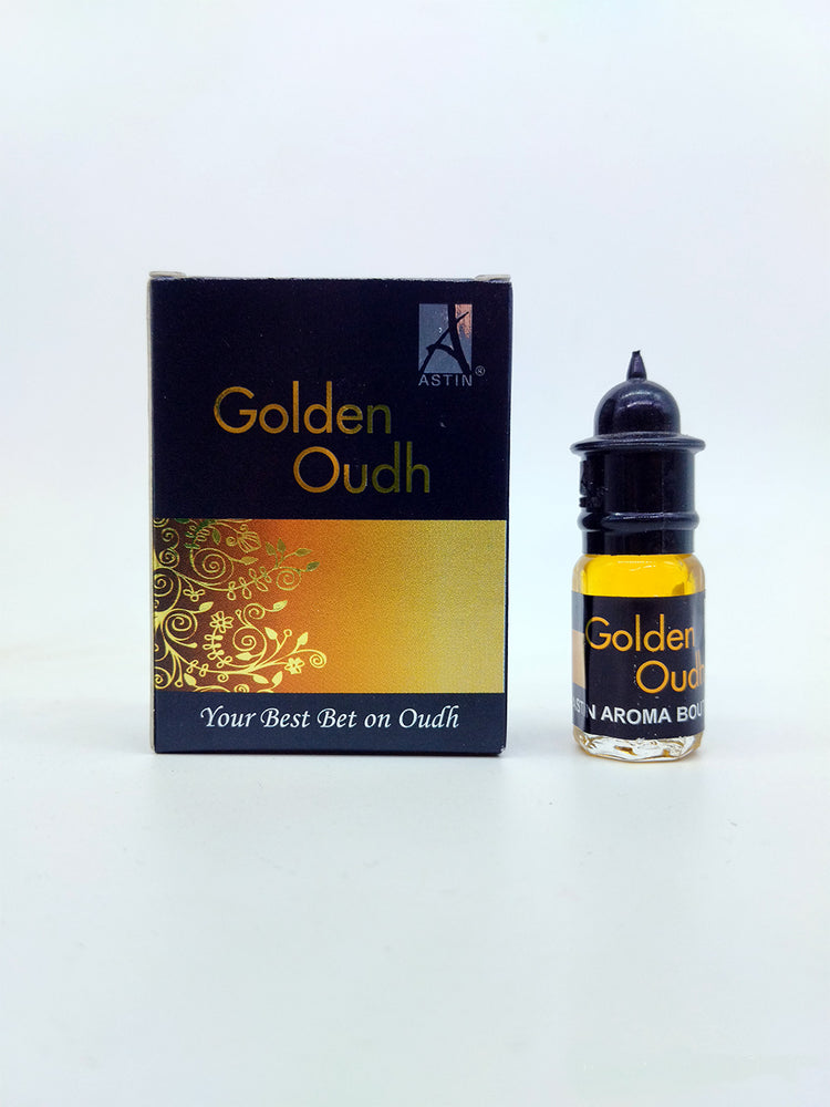 astin golden oudh attar bottle and box with white background
