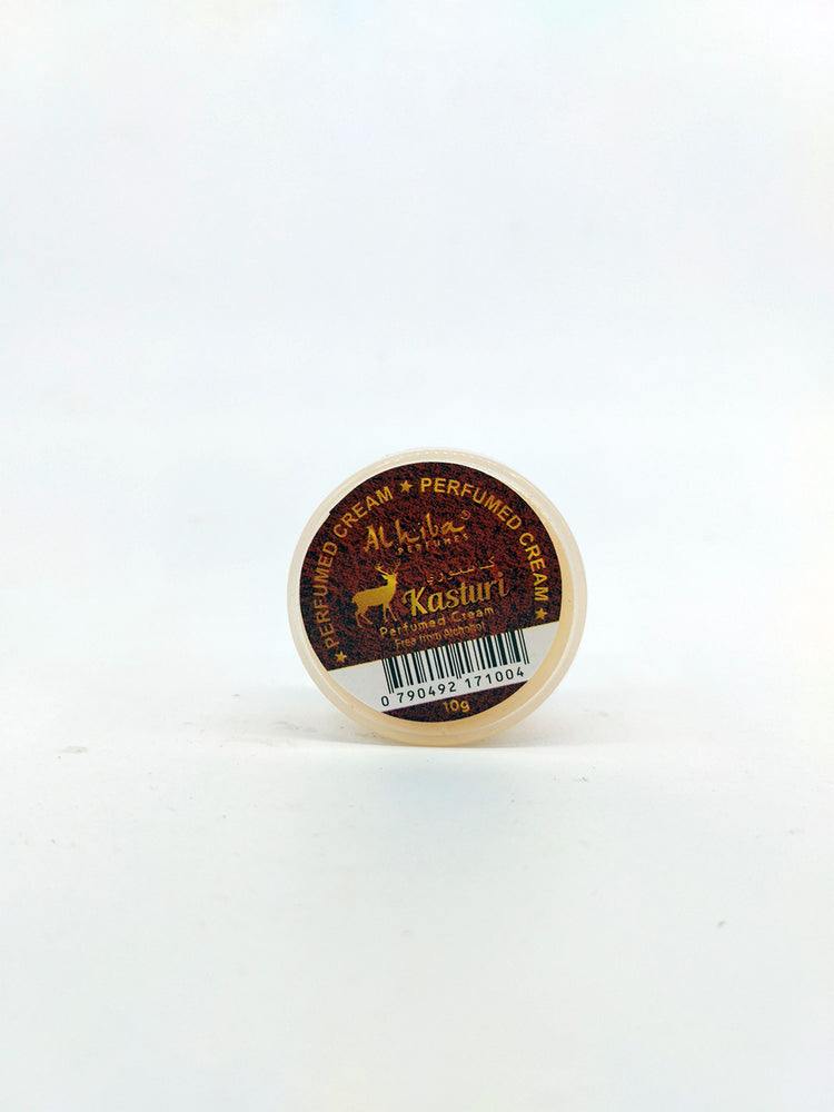 Small container of cream with a label on a white background