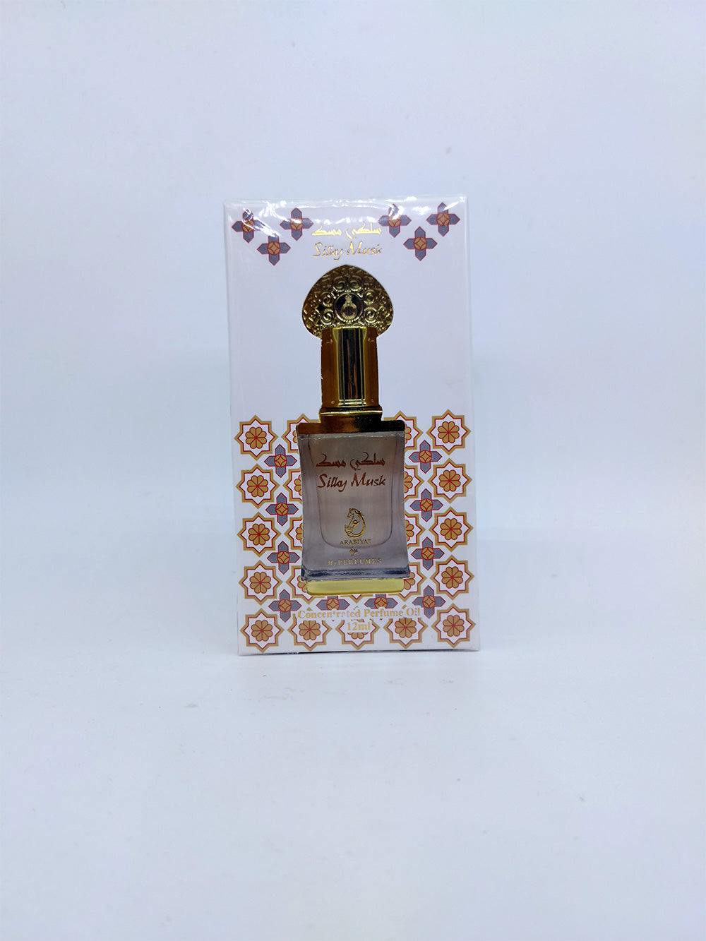 Perfume bottle with decorative packaging on a light gray background