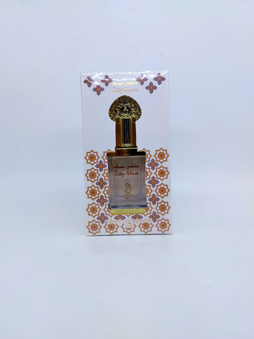 Perfume bottle with decorative packaging on a light gray background