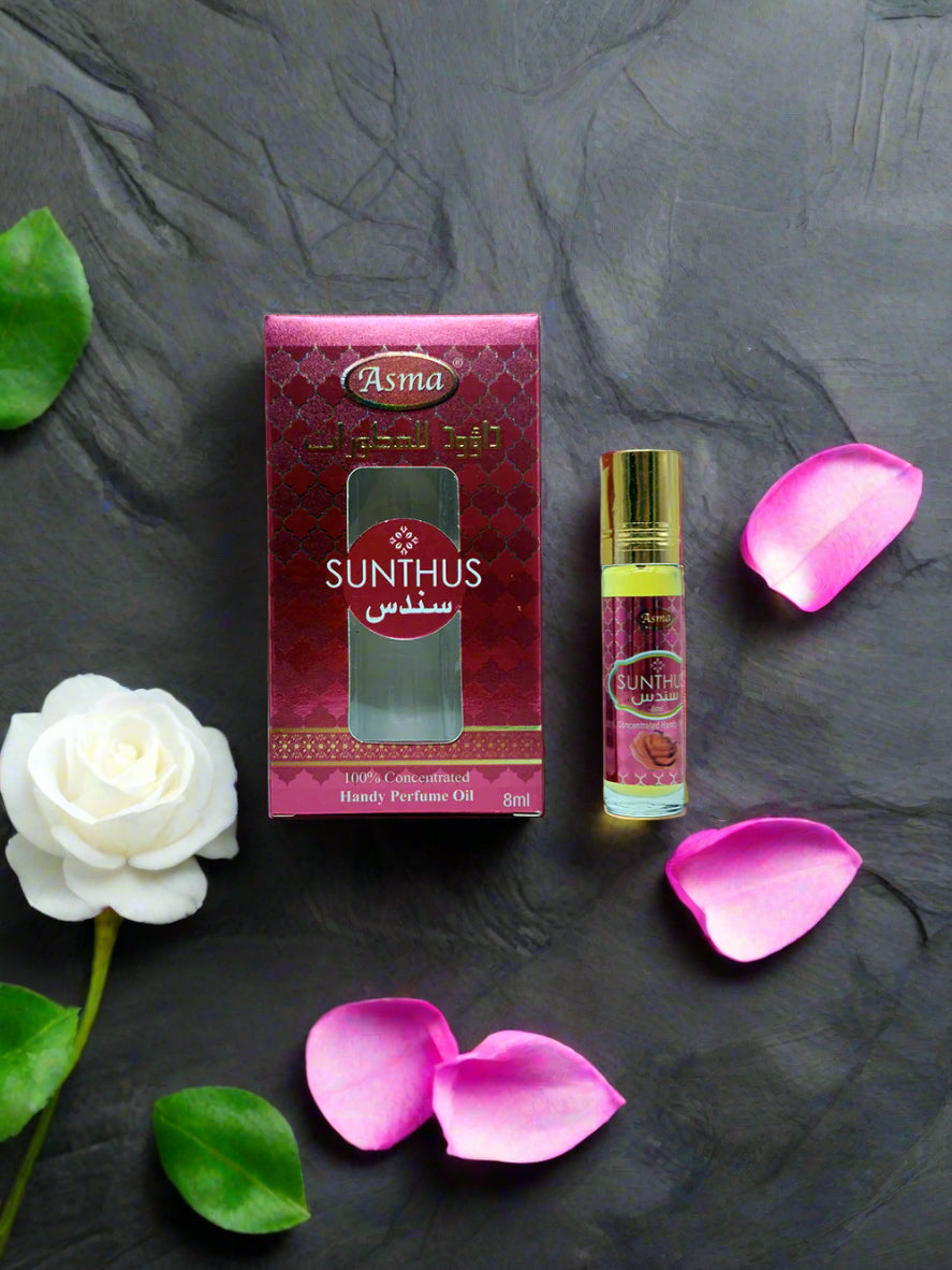 Sunthus perfume oil bottle and packaging on a light blue background