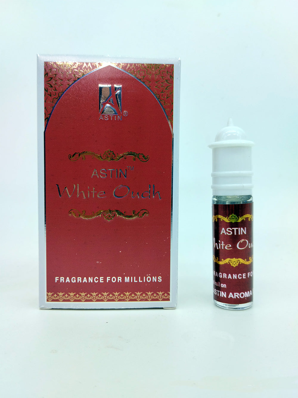 Astin White Oudh Attar bottle and box with white background